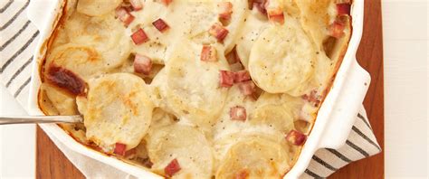 Mix flour and milk together along with undiluted soup and butter, salt and pepper then pour over. . Betty crocker scalloped potatoes and ham crock pot